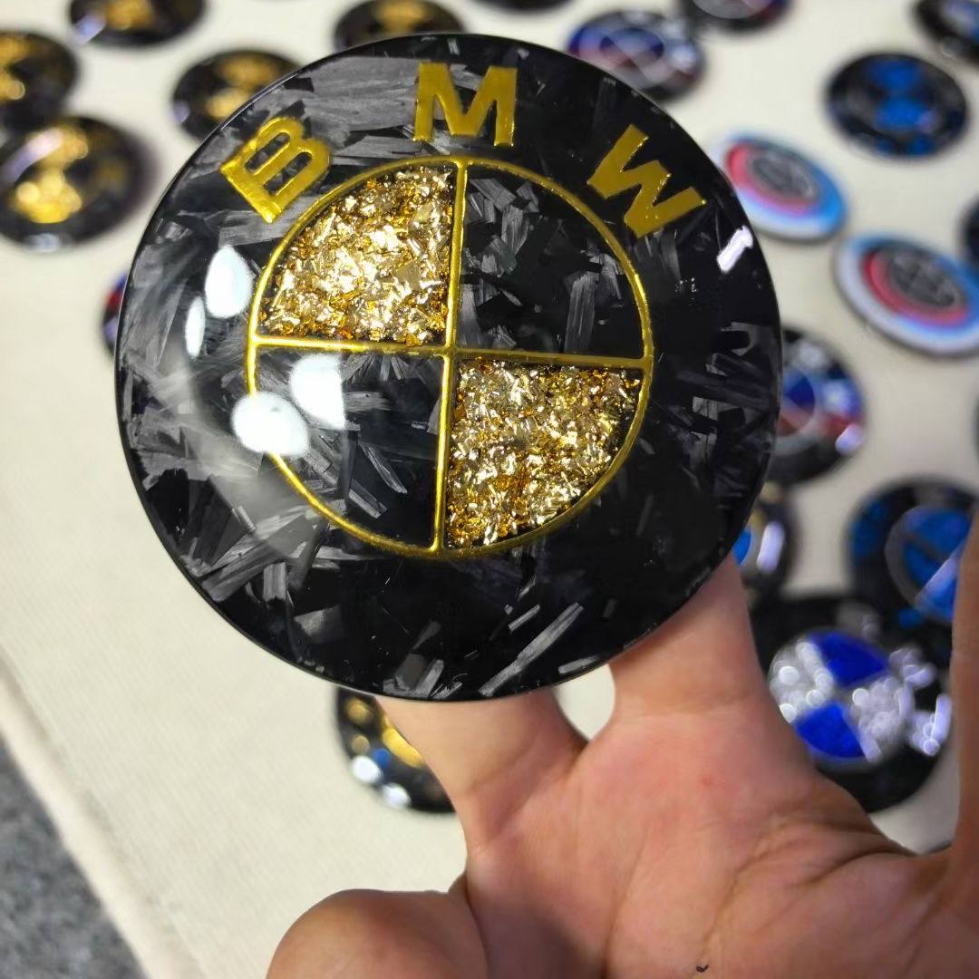 Suitable for BMW front and rear emblems, hood emblems, black and gold dual-tone front and rear wheels, custom steering wheel logos, carbon fiber